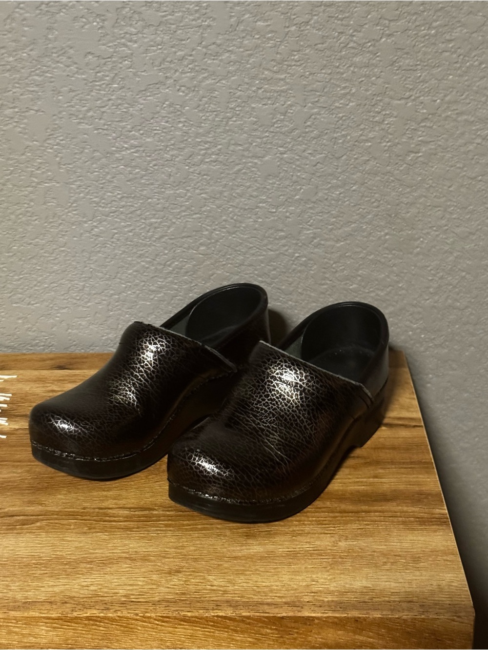 Dansko Women's Black Textured Leather Clogs